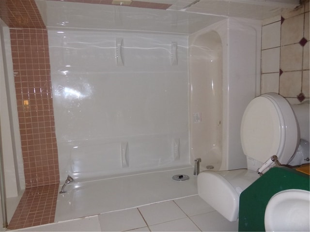 bathroom featuring tile patterned flooring and toilet