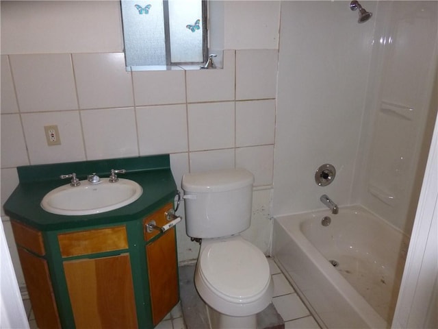 7403 Guadalupe St, Austin, TX 78752 - full bath with toilet, tile walls, vanity, and washtub / shower combination