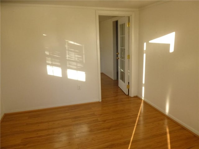 7403 Guadalupe St, Austin, TX 78752 - unfurnished room with wood finished floors and baseboards