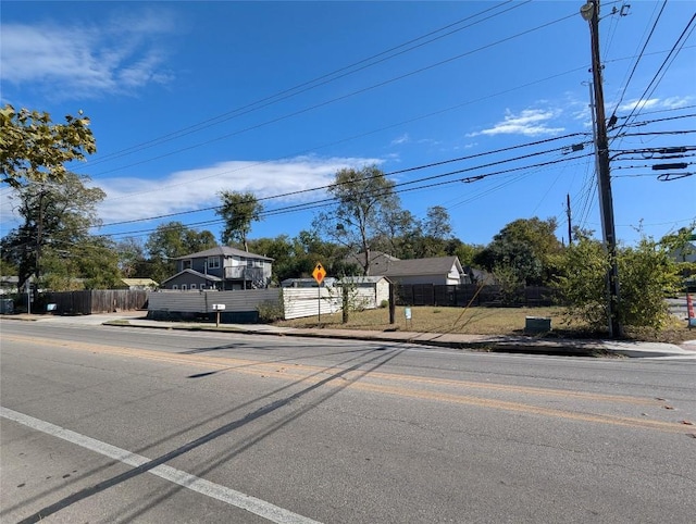 7403 Guadalupe St, Austin, TX 78752 - view of asphalt road with sidewalks, curbs, and traffic signs