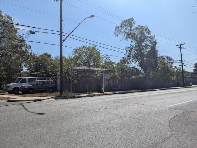7403 Guadalupe St, Austin, TX 78752 - view of asphalt road with street lights, sidewalks, and curbs