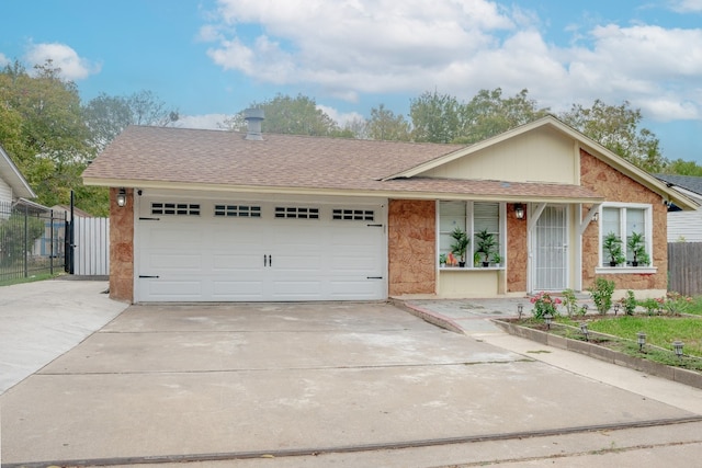 single story home featuring a garage