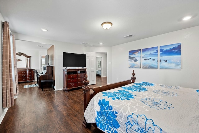 bedroom with dark hardwood / wood-style flooring