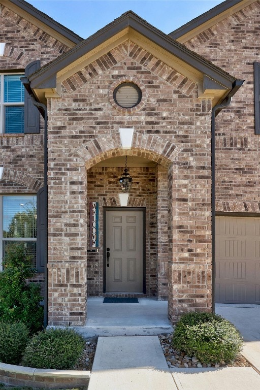 property entrance with a garage