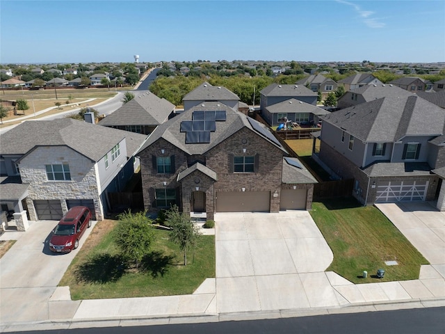 birds eye view of property with a residential view