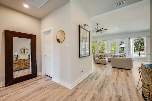 hall featuring french doors and light hardwood / wood-style floors