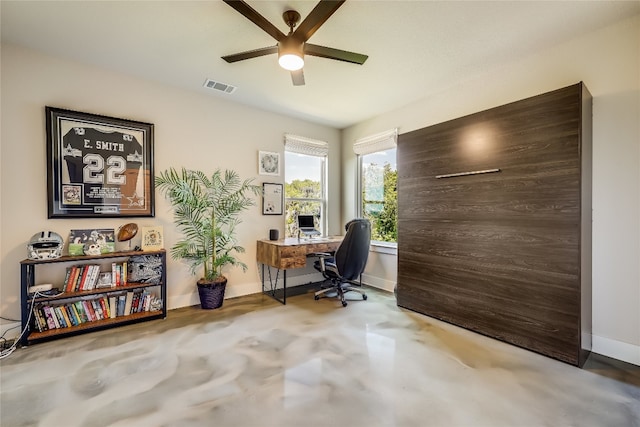 office area with ceiling fan and concrete floors