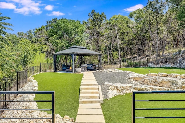 view of property's community featuring a gazebo and a lawn