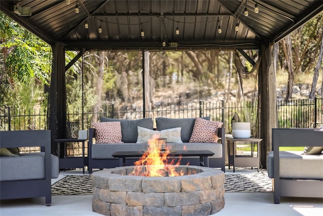 view of patio with a gazebo and an outdoor fire pit