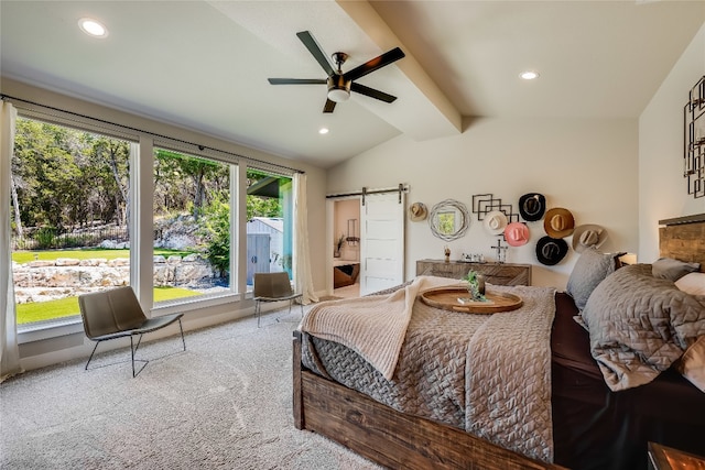 carpeted bedroom featuring vaulted ceiling with beams, ceiling fan, and a barn door