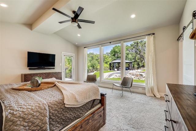 bedroom with light colored carpet, ceiling fan, and lofted ceiling