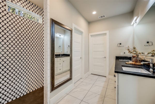 bathroom with vanity and walk in shower