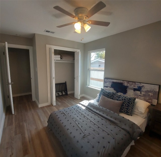 bedroom with ceiling fan, a closet, and wood-type flooring