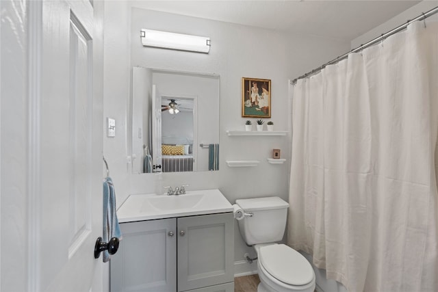 ensuite bathroom with vanity, toilet, a shower with curtain, and ensuite bathroom