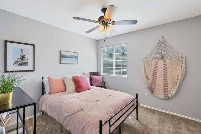 bedroom with baseboards, carpet floors, and ceiling fan