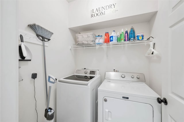 clothes washing area with laundry area and washing machine and clothes dryer