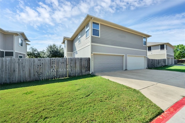 view of front of home featuring a garage and a front lawn