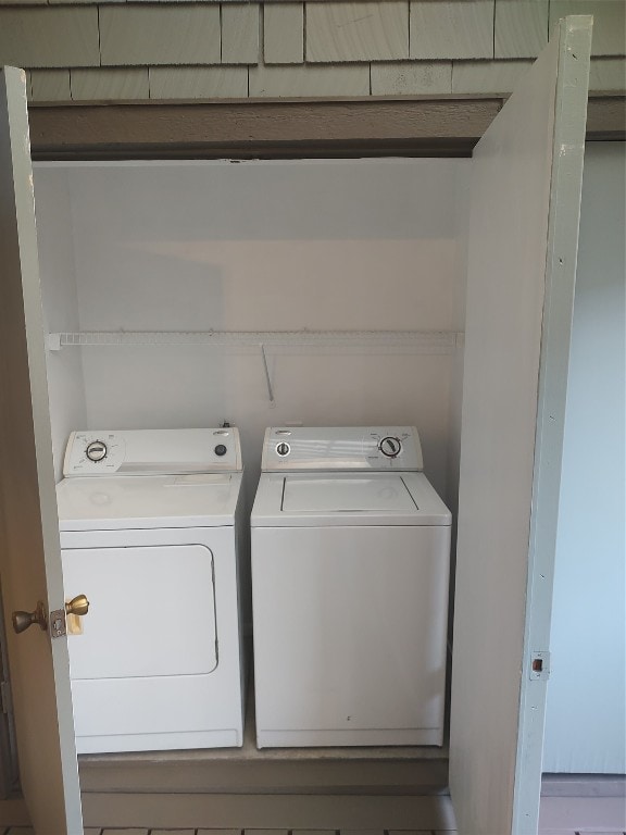 laundry area with washing machine and clothes dryer