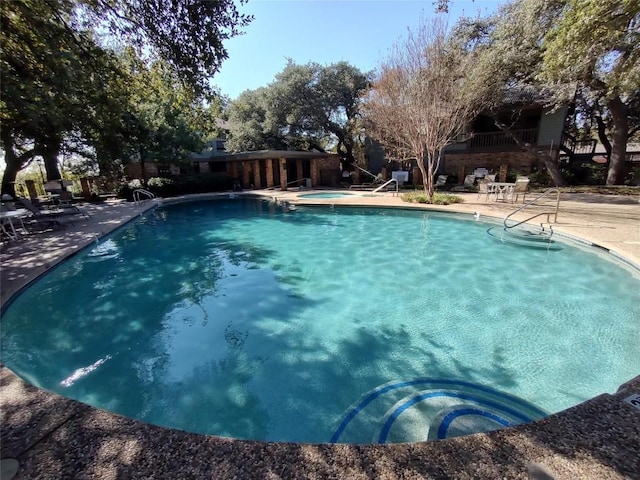 view of pool featuring a patio area