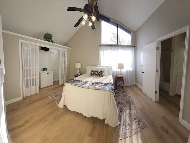 bedroom with wood-type flooring, a closet, high vaulted ceiling, and ceiling fan