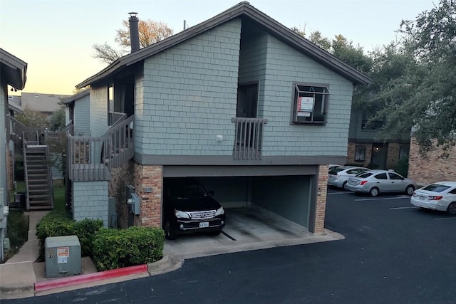 property exterior at dusk with a garage