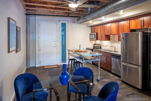 kitchen featuring tasteful backsplash, sink, and stainless steel appliances