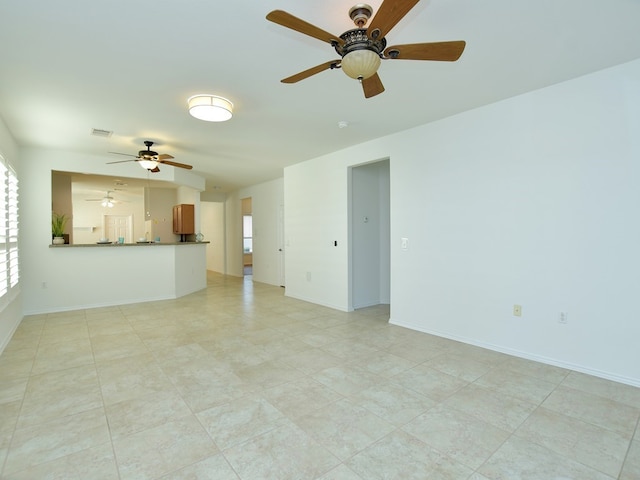 119 Hampton Cir, Georgetown, TX 78633 - unfurnished living room featuring a ceiling fan and baseboards