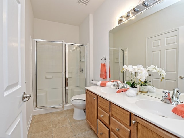 bathroom featuring walk in shower, tile patterned flooring, vanity, and toilet