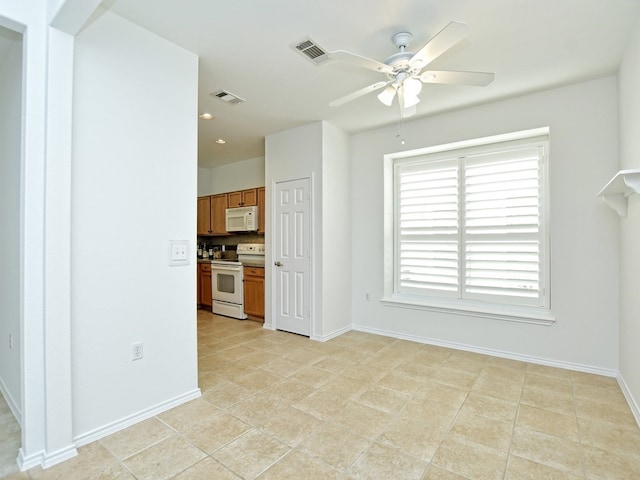 kitchen featuring ceiling fan, white appliances, backsplash, and light tile patterned floors