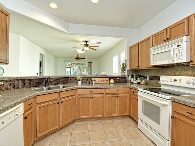 kitchen with sink, ceiling fan, light tile patterned floors, backsplash, and white appliances