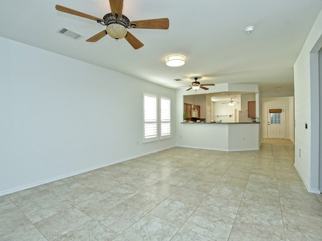 unfurnished living room featuring light tile patterned floors