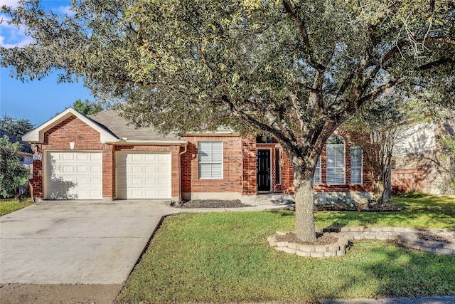 view of front of property with a garage and a front yard