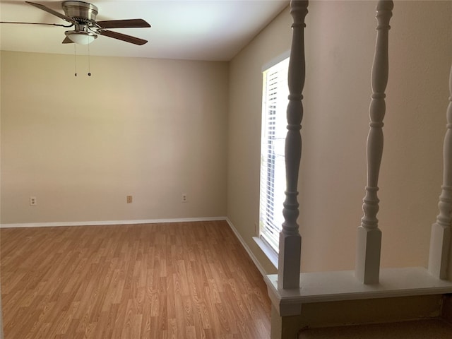 spare room with light hardwood / wood-style flooring and ceiling fan