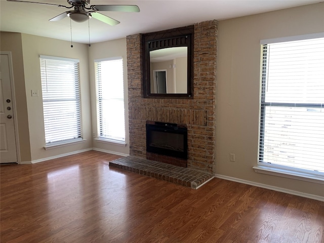 unfurnished living room featuring hardwood / wood-style flooring and ceiling fan