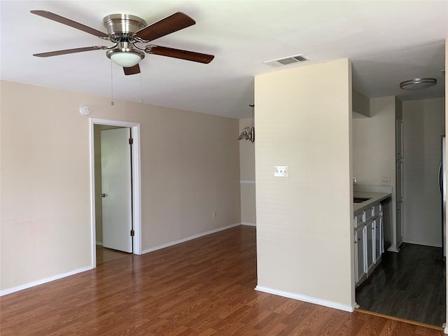 interior space featuring dark hardwood / wood-style floors, ceiling fan, and sink