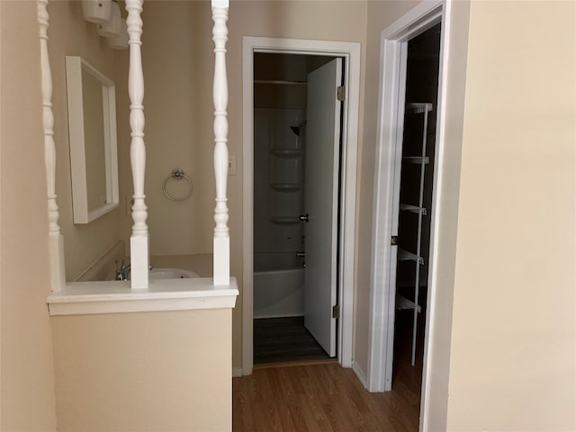 hallway with wood-type flooring