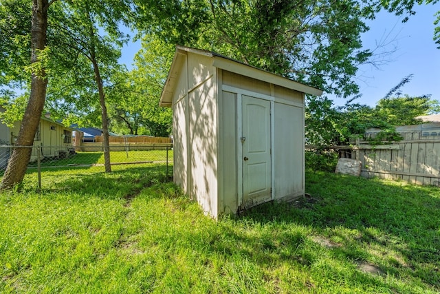 view of outdoor structure with a lawn