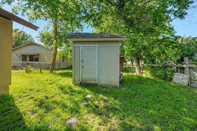 view of outdoor structure with a lawn