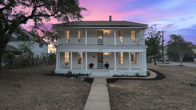 view of front facade featuring a porch and a balcony