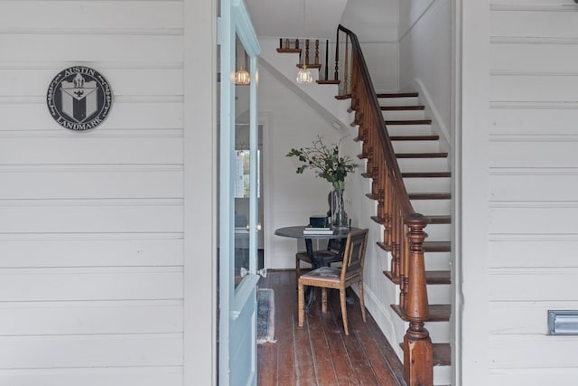 stairs featuring wood-type flooring