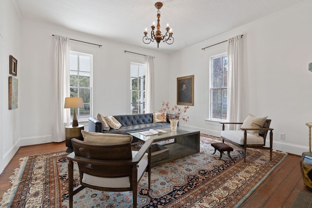 living room with an inviting chandelier and hardwood / wood-style floors