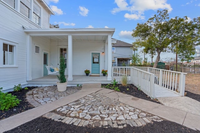 property entrance featuring covered porch