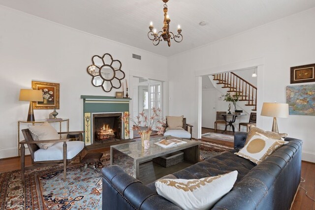 living room with wood-type flooring and a chandelier