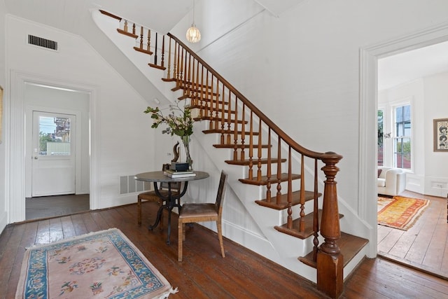 stairs featuring hardwood / wood-style flooring