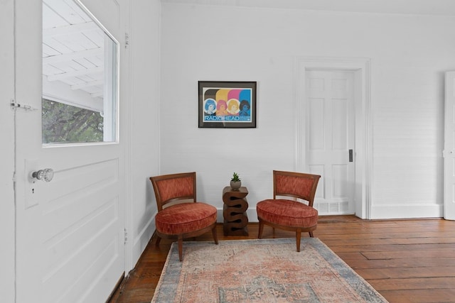 sitting room featuring dark hardwood / wood-style flooring