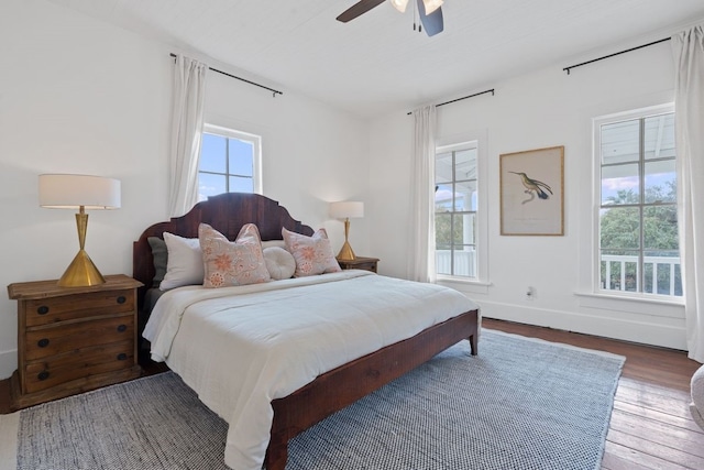 bedroom with hardwood / wood-style floors and ceiling fan