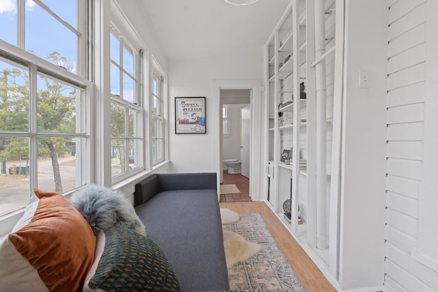 interior space featuring light hardwood / wood-style floors and lofted ceiling