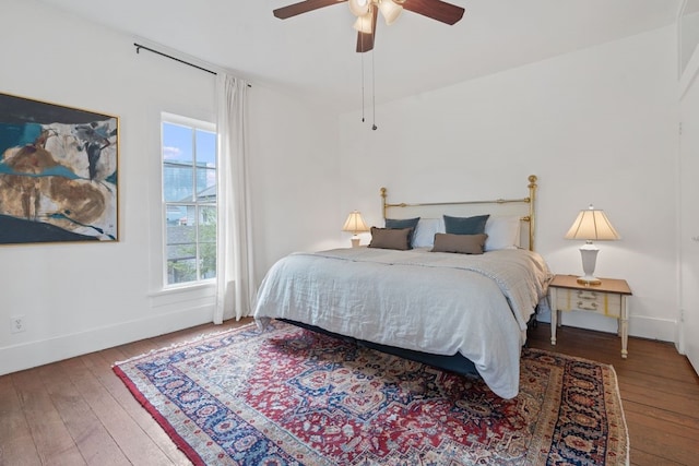 bedroom with hardwood / wood-style flooring and ceiling fan