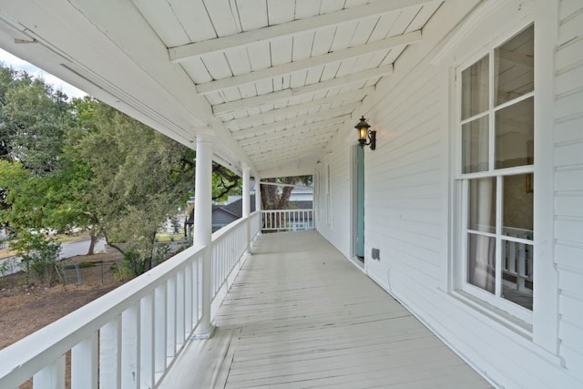 wooden terrace with a porch