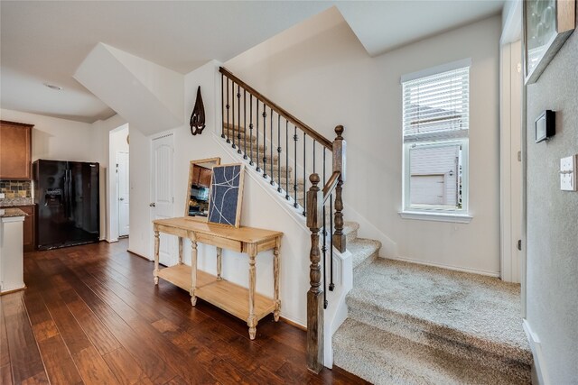 stairs with wood-type flooring